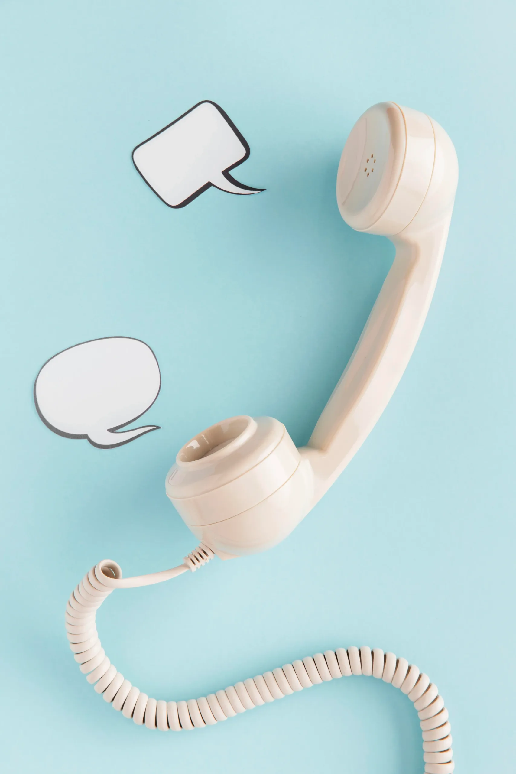 flat-lay-retro-telephone-receiver-with-chat-bubbles flat lay retro telephone receiver with chat bubbles scaled